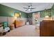 Bedroom with green walls, wooden crib, and dresser at 2122 Leopold St, Johns Island, SC 29455