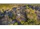 Aerial view of a property with a house and several outbuildings, surrounded by trees at 326 Turner Ln, Round O, SC 29474
