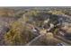 Aerial view showing a house nestled among trees and a long driveway at 326 Turner Ln, Round O, SC 29474