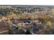 Aerial view of a house with a long driveway leading to it, surrounded by trees at 326 Turner Ln, Round O, SC 29474