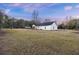 Spacious backyard with large grassy area, providing ample outdoor space at 326 Turner Ln, Round O, SC 29474
