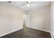 Bright bedroom with ceiling fan and dark wood-look flooring at 326 Turner Ln, Round O, SC 29474