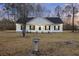 Charming single-story home with a covered porch and well-maintained landscaping at 326 Turner Ln, Round O, SC 29474