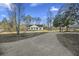 White house with a gravel driveway and large yard at 326 Turner Ln, Round O, SC 29474