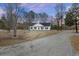 White house with black shutters and gravel driveway at 326 Turner Ln, Round O, SC 29474