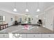 Open concept kitchen with granite countertops, island, and views into living area at 326 Turner Ln, Round O, SC 29474