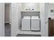 Convenient laundry room with washer and dryer, plus shelving at 326 Turner Ln, Round O, SC 29474