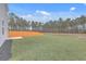 Private backyard with wooden fence and pond view at 343 Lake Ridge Blvd, Summerville, SC 29483