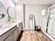 Main bathroom with double vanity, large mirror, and walk-in shower at 343 Lake Ridge Blvd, Summerville, SC 29483