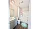 Bathroom with single vanity, tub, and decorative rug at 343 Lake Ridge Blvd, Summerville, SC 29483