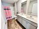 Shared bathroom with double vanity and tub shower combo at 343 Lake Ridge Blvd, Summerville, SC 29483
