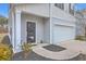 Charming home featuring a gray exterior, a front door with glass panes, and an attached garage at 343 Lake Ridge Blvd, Summerville, SC 29483
