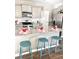 Kitchen island with granite countertop and teal stools at 343 Lake Ridge Blvd, Summerville, SC 29483
