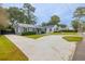 House on a tree-lined street with a circular driveway at 39 Wedgepark Rd, Charleston, SC 29407