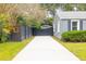 Long private driveway leading to a house with a black gate at 39 Wedgepark Rd, Charleston, SC 29407