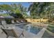 Relaxing pool area with lounge chairs and patio furniture at 4 Hester St, Charleston, SC 29403