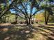 Spacious backyard with mature trees and partial view of house at 400 Murray Blvd, Summerville, SC 29483