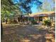 Ranch-style brick home nestled on a spacious lot with mature trees at 400 Murray Blvd, Summerville, SC 29483