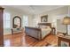 Main bedroom with hardwood floors and a sleigh bed at 4000 Cameron Blvd, Isle of Palms, SC 29451