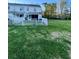Backyard with large grassy area and white fence at 406 Chinquapin Dr, Summerville, SC 29485
