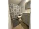Bathroom with gray vanity and patterned shower curtain at 406 Chinquapin Dr, Summerville, SC 29485