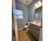 Small bathroom with gray vanity and tile floor at 406 Chinquapin Dr, Summerville, SC 29485