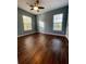 Bedroom with dark wood flooring and two windows at 406 Chinquapin Dr, Summerville, SC 29485