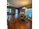 Dining area features hardwood floors and a round wooden table with chairs at 406 Chinquapin Dr, Summerville, SC 29485
