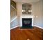 Gas fireplace with a white mantel and built-in shelving at 406 Chinquapin Dr, Summerville, SC 29485