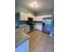 Kitchen boasts white cabinets, stainless steel appliances, and granite countertops at 406 Chinquapin Dr, Summerville, SC 29485