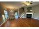Living room features hardwood floors, a fireplace, and access to the dining area at 406 Chinquapin Dr, Summerville, SC 29485