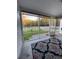 Screened porch overlooking fenced backyard with view of trees at 406 Chinquapin Dr, Summerville, SC 29485