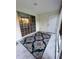 Screened porch with patterned rug and sliding glass doors at 406 Chinquapin Dr, Summerville, SC 29485