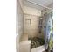 Walk-in shower with pebble floor and built-in seat at 406 Chinquapin Dr, Summerville, SC 29485