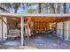 Open-air storage area with wood pile and swing at 4118 Dorsey Ave, North Charleston, SC 29405