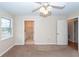 Spacious bedroom with ceiling fan and access to bathroom at 445 Parkdale Dr, Charleston, SC 29414