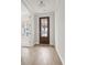 Bright entryway with hardwood floors and a rich wood front door at 519 Eagleview Dr, Moncks Corner, SC 29461