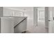 Upstairs hallway with neutral carpet and access to bedrooms at 519 Eagleview Dr, Moncks Corner, SC 29461