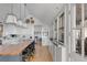 Modern kitchen with a large island and white cabinetry at 70 Warren St, Charleston, SC 29403