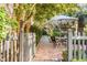 Brick patio with seating area under a shade umbrella at 70 Warren St, Charleston, SC 29403