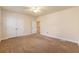 Bright bedroom featuring carpet, double doors to closet, and access to upper level at 8409 Hidden Bakers Trce, North Charleston, SC 29418