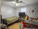 Bedroom with twin beds, TV, and ceiling fan at 9812 Berrywood Dr, Ladson, SC 29456