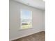 Bright bedroom with wood-look floors and a window at 104 River Hill Rd, Goose Creek, SC 29445