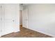 Bedroom with wood-look floors and access to hallway at 104 River Hill Rd, Goose Creek, SC 29445