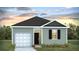 Charming one-story house with gray siding, white garage door, and landscaping at 104 River Hill Rd, Goose Creek, SC 29445