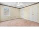 Bedroom with neutral walls, carpet, and double door closet at 1045 Shinnecock Hills Ct, Summerville, SC 29483