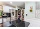 Modern kitchen with white cabinets, black countertops, and walk-in pantry at 106 Merriweather Ct, Summerville, SC 29485