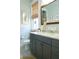 Modern bathroom with gray vanity and granite countertop at 1104 Hitchfield Ln, Awendaw, SC 29429