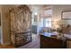 Charming bedroom with antique armoire and bathroom view at 1104 Hitchfield Ln, Awendaw, SC 29429
