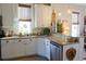 Spacious kitchen with granite countertops and white cabinets at 1104 Hitchfield Ln, Awendaw, SC 29429